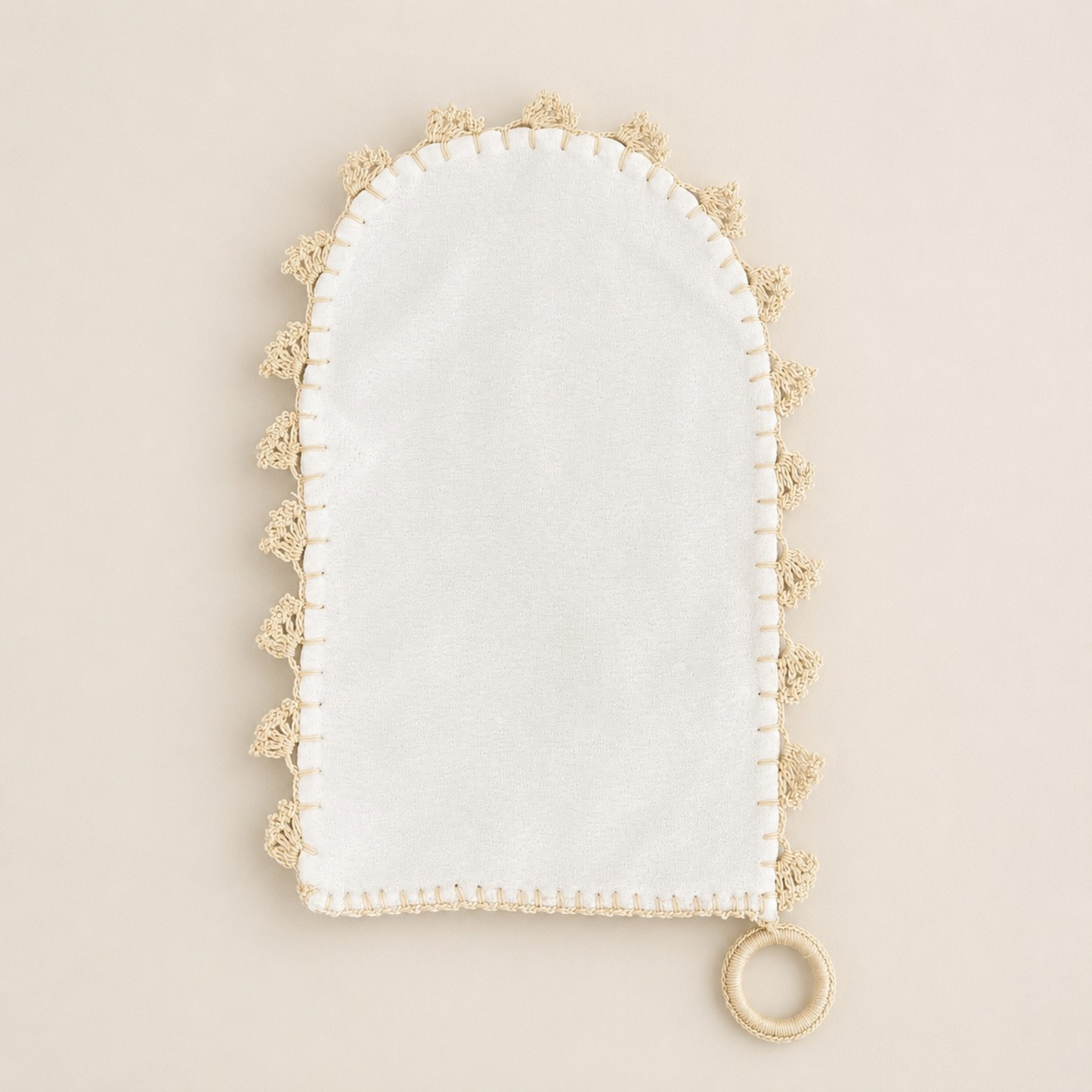 Full view of DerviĆ handwoven ivory crĂȘpe silk Turkish hammam kese with handmade needle-lace edging and hanging loop.