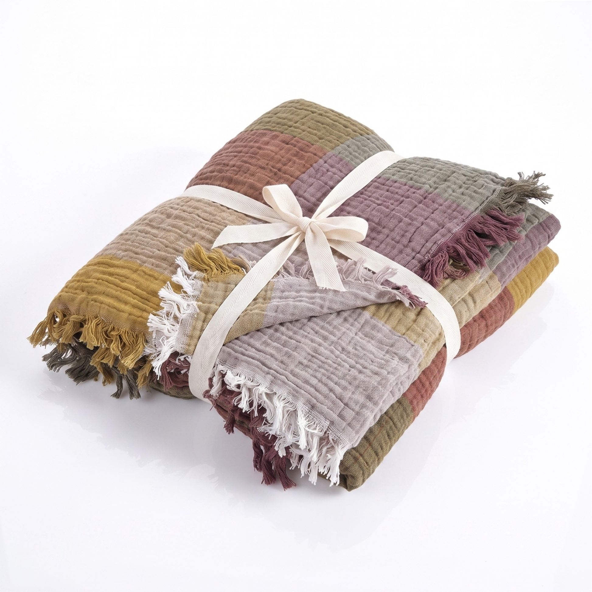 Stack of multicolored Cotton Plaid Throw Blanket – Sofa Throw & Picnic Blanket tied with a ribbon on a white background