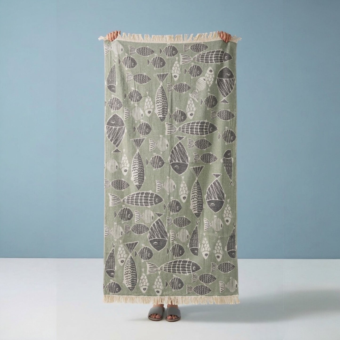 Fish Pattern 3-Layer Turkish Towel – Jacquard Woven Muslin Beach Towel on a light blue background