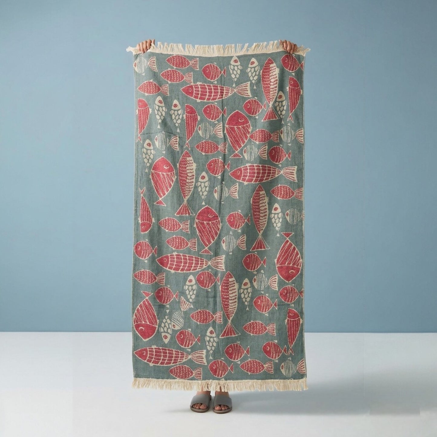 Fish Pattern 3-Layer Turkish Towel – Jacquard Woven Muslin Beach Towel on a blue background