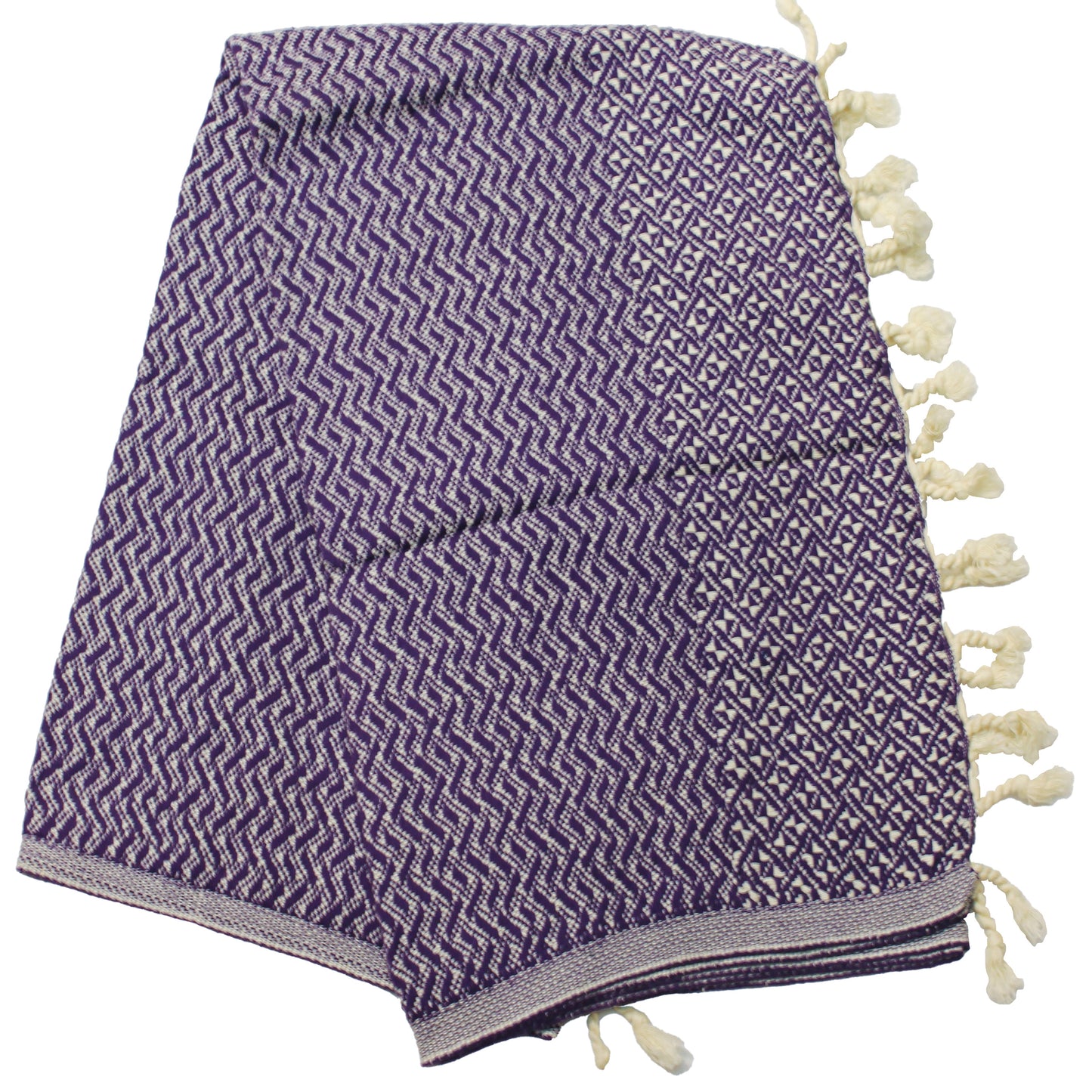 A purple Turkish towel with a geometric pattern and tassels on the end, laid out on a plain background.